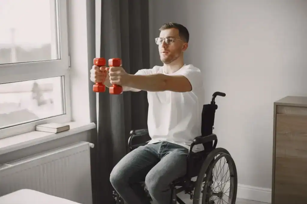 Image of man doing exercise in his wheelchair to aid weight loss Halesowen
