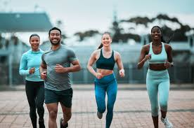 image of people running to incorporate cardio Halesowen exercise into their life to help tone arms and body.