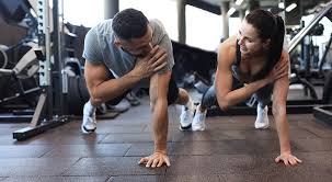 Image of man and woman doing Cardio Halesowen to tone their arms. 